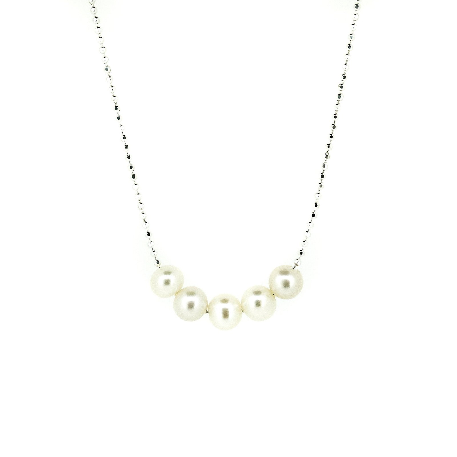 A sterling silver necklace with a chain link design and five rounded freshwater pearls placed along the length of the chain.